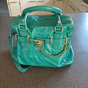 Turquoise Handbag with Gold Accents